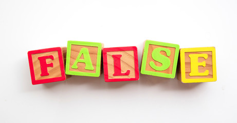 False word made from colourful wooden baby development blocks