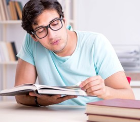 Young handsome student preparing for school exams