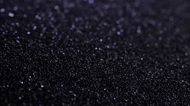 Black sand grunge background. Сlose-up.