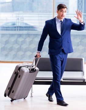 Businessman waiting at the airport for his plane in business cla