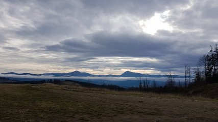Colorful autumn landscape in the Carpathian mountains with mountain peaks. Carpathians, Ukraine, Europe. World of beauty. Forest with orange leaves. Autumn sunny day in western Ukraine.