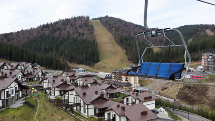 Ukraine, Bukovel - November 20, 2019. Autumn view of the ski resort with a chairlift against the...