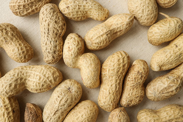 peanuts, top view, peanut fruits, peanuts on a tablecloth. food and drink concept