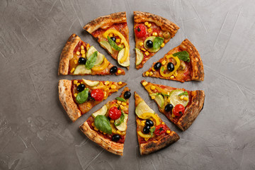 Delicious vegetable pizza on grey table, flat lay
