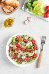 Vegetarian Fattoush salad. Traditional Middle Eastern salad with toasted pita bread and vegetables. Lebanese cuisine