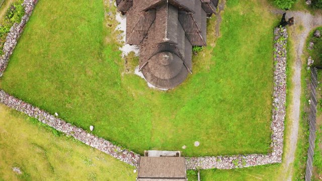 Aerial View Of The Gol Stave Church On The Lush Field In Oslo, Norway - top-down shot