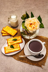 Healthy breakfast. Cup of coffee (black tea), milk, crackers with butter and salmon