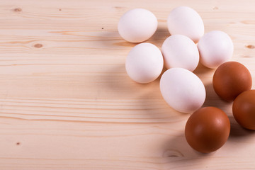 chicken raw eggs on the rustic wooden surface
