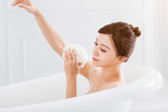  young woman take a bath in bathtub