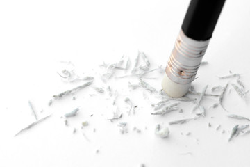 pencil eraser removing on a white paper. Concept of error and correction.