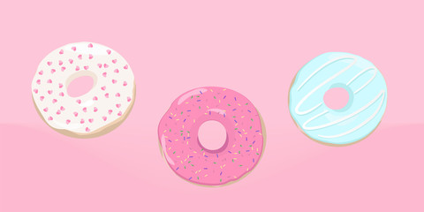 Colorful delicious donuts on a pink background.