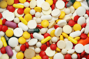 Different colorful tablets at white background