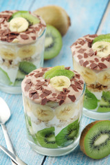 Trifle desserts with bananas, kiwi and yogurt