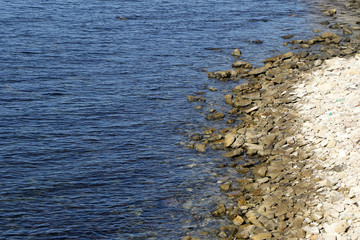 Sea shore with stones in the summer