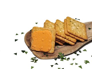 Sandwich crackers with cheese cream on wooden board