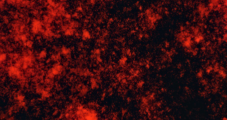 Vibrant abstract background for aggressive design. Blurred red spots on a black background.