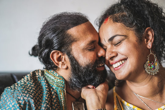 Indian husband and wife having tender moments - Portrait of happy southern asian couple - Love, ethnic and india's culture concept - Focus on woman eye