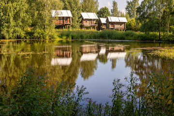 Fototapeta premium The Museum of wooden architecture under the open sky. Old traditional Russian peasant house. Golden ring of Russia. Kostroma Sloboda, Kostroma, Russia
