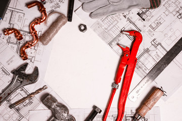 plumbing tools and equipment on white with copy space