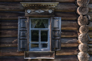The Museum of wooden architecture Kostroma Sloboda,. Window with platbands of the old traditional Russian peasant house. Golden ring of Russia.