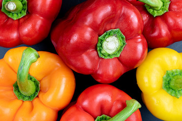 full-frame shot of red, orange and yellow bell peppers