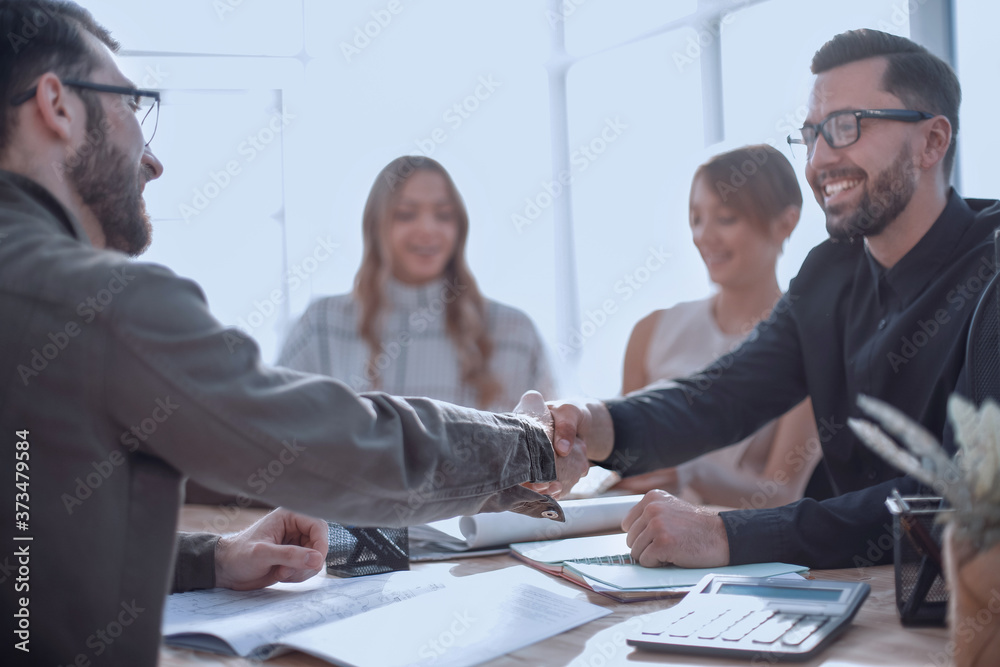 Wall mural smiling businessman at a working meeting in the office