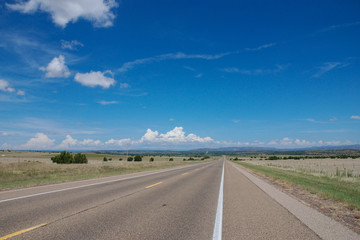 Naklejka premium Road from Santa Rosa to Santa Fe in New Mexico, USA. August 5, 2007.