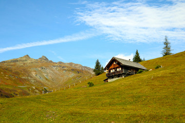 Beautiful small wooden house on a mountainside.