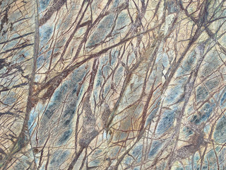 Cracked old grey stone wall texture