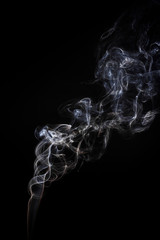 Freeze motion of smoke on black background.  Abstract vape clouds.