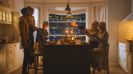 Happy Family Celebrating together, Sitting at the Table Eating Delicious Dinner Meal. Little Child,...
