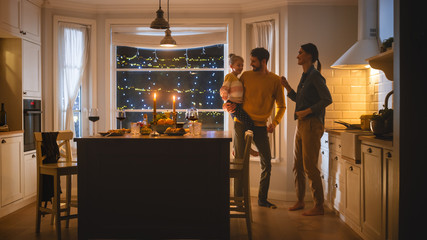 Happy Family of Three Having Great Time after Dinner Dancing Together. Strong Father Holds and Hugs Cute Little Daughter, They Dance Together with Beautiful Young Mother. Cozy Evening Celebration