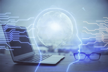 Multi exposure of work table with computer and brain hologram. Brainstorm concept.