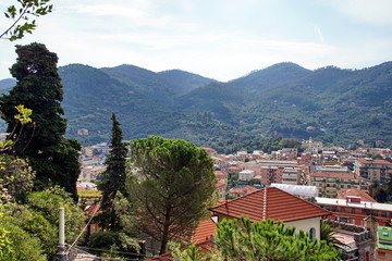 Beautiful daylight view to green mountains and buildings of Levanto, Italy. Cinque Terre beauties