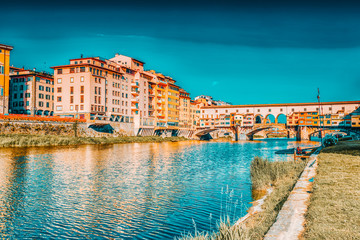 Fototapeta premium Ponte Vecchio is a bridge in Florence, located at the narrowest point of the Arno River, almost opposite the Uffizi Gallery.Italy.