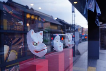 Japanese old style fox and okame face masks are in show window in Kawagoe, old edo town, Japan.