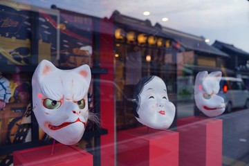 Japanese old style fox and okame face masks are in show window in Kawagoe, old edo town, Japan.
