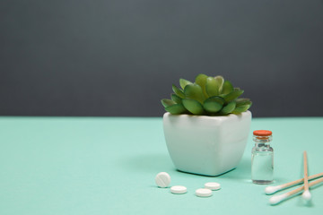 Assorted medical drugs and syringe on blue background
