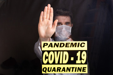 Doctor man using mask with open hand doing stop sign with serious and confident expression, defense...