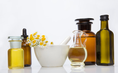 Obraz na płótnie Canvas Homeopathic medicine concept of mortar and pestle containing fresh herbs.