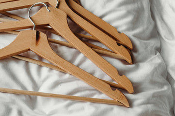 A many wooden clothes hanger.