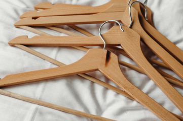 A many wooden clothes hanger.
