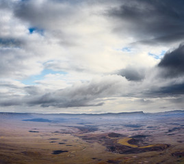 Mountain landscape against the backdrop of a stormy sky.