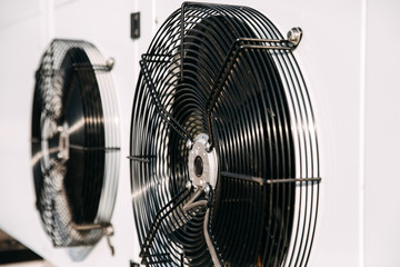 Closeup of an industrial air conditioning fan working.