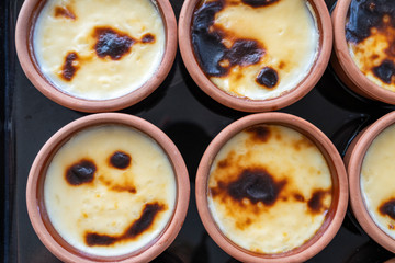 Fototapeta na wymiar Turkish traditional dessert; sutlac. Baked Rice Pudding on oven tray