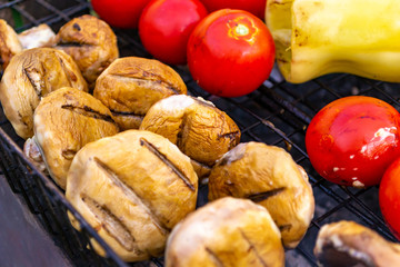 Grilled vegetables eggplants, bell peppers, tomatoes, mushrooms , in smoke