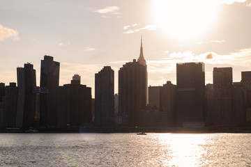 Midtown Manhattan Skyline during a Bright Sunset over the East River in New York City