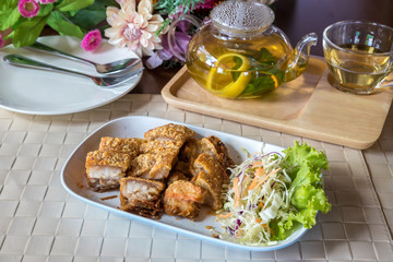 Chinese or Thai roasted crispy pork. Deep fried pork belly with liver sauce. Oriental Roast Pork Belly on white plate.