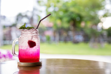 Italian Soda Cold Beverage and strawberry Fruit on top in cafe. strawberry drink (cocktail) with...