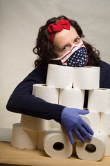Woman wearing a patriotic covid mask and protecting her toilet paper rolls